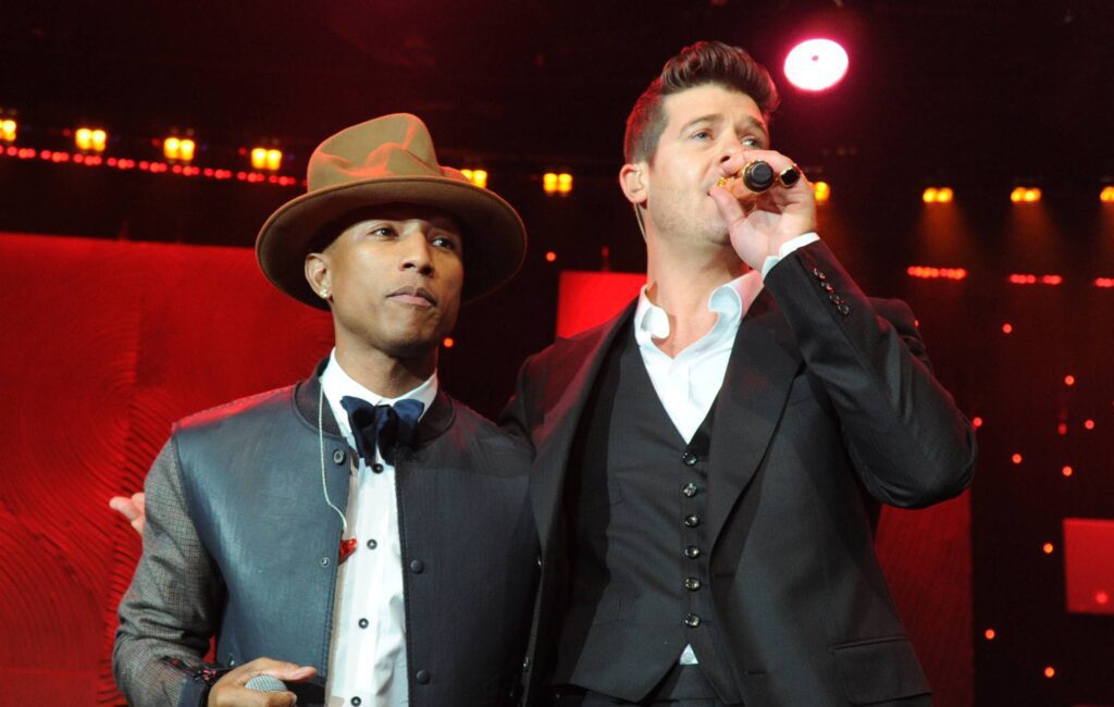 Pharrell Williams and Robin Thicke perform onstage during the 56th annual GRAMMY Awards Pre-GRAMMY Gala and Salute to Industry Icons honoring Lucian Grainge at The Beverly Hilton on January 25, 2014 in Los Angeles, California. (Photo by Kevin Mazur/WireImage)