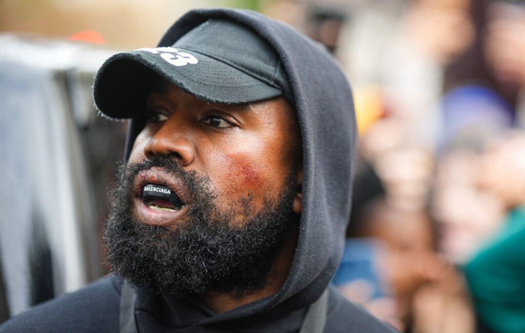 Kanye West aka Ye is seen wearing a Balenciaga boxing mouthguard, outside Givenchy, during Paris Fashion Week - Womenswear Spring/Summer 2023 - Day Seven on October 02, 2022 in Paris