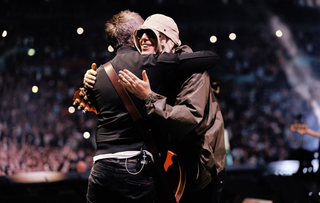 Watch Noel and Liam Gallagher’s final hug of the Oasis reunion tour as Bonehead celebrates “the best year of my life”