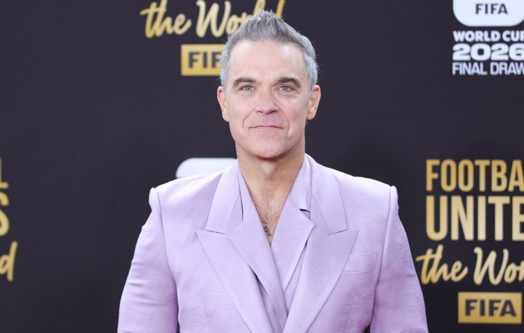 Robbie Williams says he’s “Bruce Wayne in Los Angeles and Batman everywhere else”